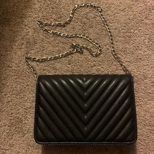 Black flap bag crossbody.